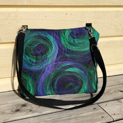 Vihreä avaruus olkalaukku on tehty käsinmaalatusta kankaasta